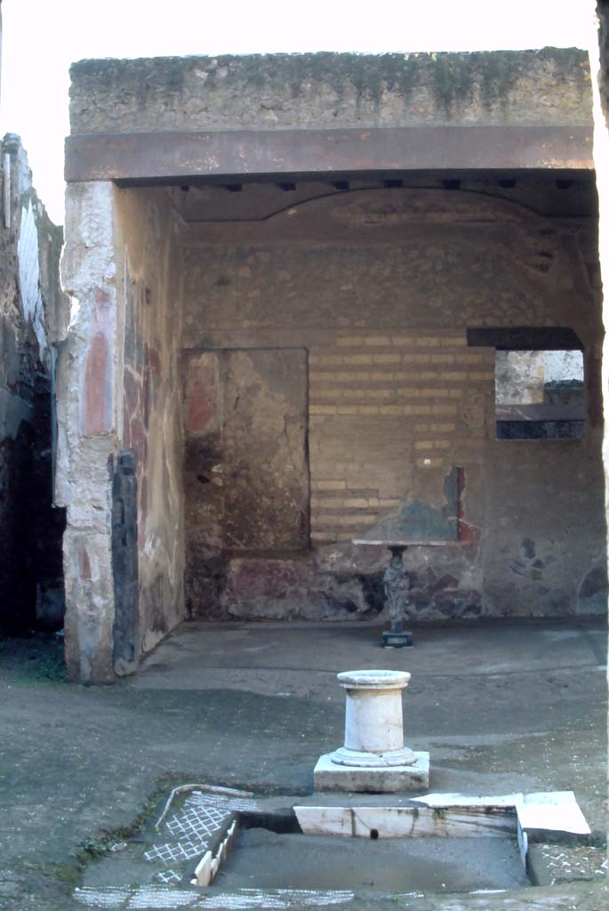 VI.17 Herculaneum. 4th December 1971. Looking south across impluvium in atrium towards tablinum.
Photo courtesy of Rick Bauer, from Dr George Fay’s slides collection.